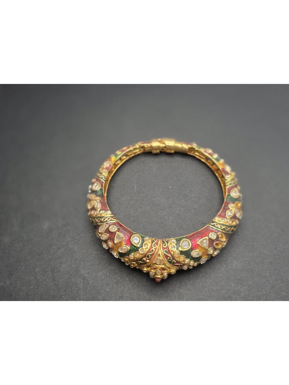 Vintage Ornate Gold Tone Bangle Bracelet with Red and Multicolor Gem Details